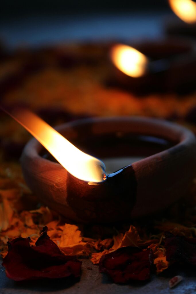Close-up of a candle flame, creating a warm and calming atmosphere.